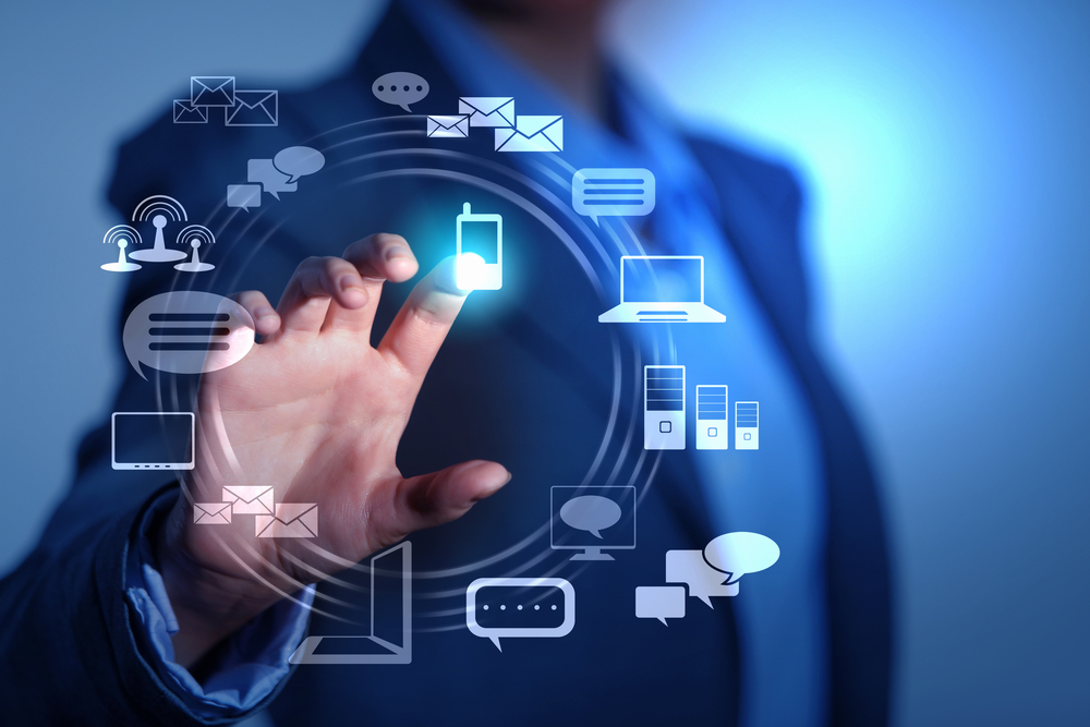 Business person pushing symbols on a touch screen interface Business person pushing symbols on a touch screen interface